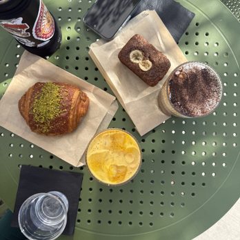 Concierge Coffee - clockwise from left: pistachio croissant, banana bread, einspänner, saffron latte - Coffee & Tea Near Me - Los Angeles, California