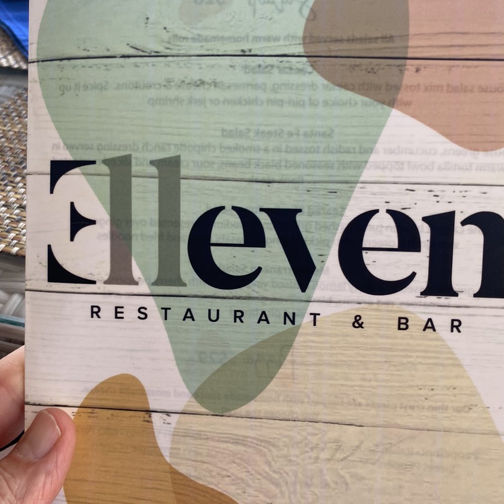 Eleven Restaurants & Bar - a hand holding a menu - Salad Near Me - Gulf Gate Estates, Florida Eleven Restaurants & Bar - a hand holding a menu - Salad Near Me - Gulf Gate Estates, Florida