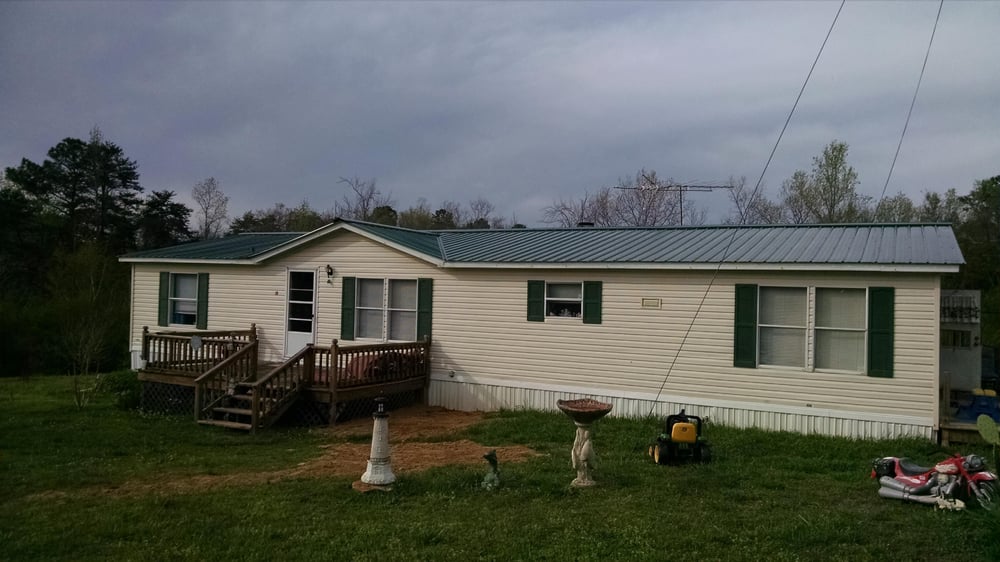 Slide of JC Metal Roofing