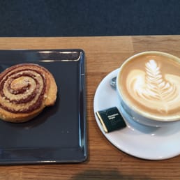 Cappuccino, cinnamon bun and a piece of dark mint chocolate.