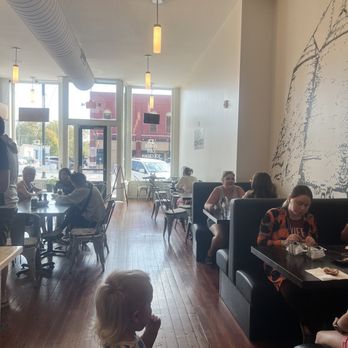 Beans And Beignets - people sitting at tables in a restaurant - Breakfast & Brunch Near Me - Earlham, Iowa