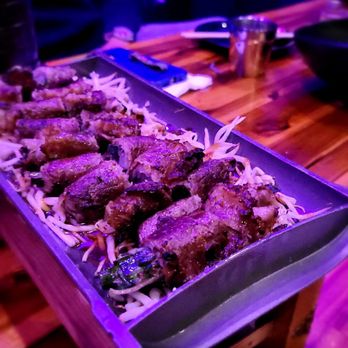 Sum Fusion Kitchen & Bar - a tray of food on a table - Asian Fusion Near Me - Carrollton, Texas Sum Fusion Kitchen & Bar - a tray of food on a table - Asian Fusion Near Me - Carrollton, Texas