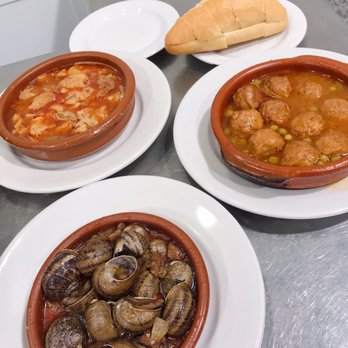 Postas - Callos- tripe stew top left. Abondigas, meatballs top right. DELICIOUS - Spanish Near Me - Madrid, M