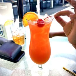 a person holding a drink a person holding a drink