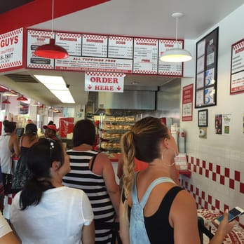 Five Guys - Register/kitchen and menu. - Burgers Near Me - Miami Beach, Florida Five Guys - Register/kitchen and menu. - Burgers Near Me - Miami Beach, Florida