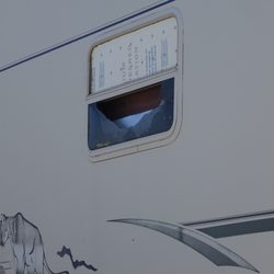 Tra-Tel Tucson RV Park - Trailer with broken out window