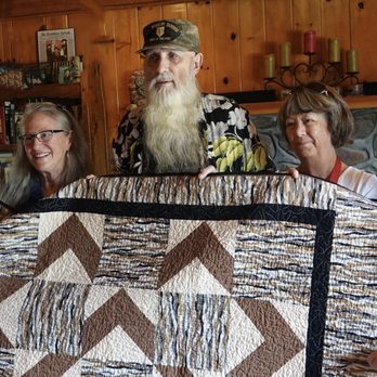 Walgreens - a group of people holding a quilt - Drugstores Near Me - Tucson, Arizona Walgreens - a group of people holding a quilt - Drugstores Near Me - Tucson, Arizona