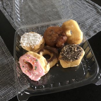 Ed and Barb Cream Donuts - Coconut filler, Apple fritter, chocolate glaze, strawberry glaze with sprinkles, regular glaze, and Oreo with cream filler. - Donuts Near Me - Lake City, Florida