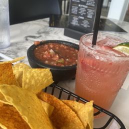 Chips and salsa with a strawberry margarita