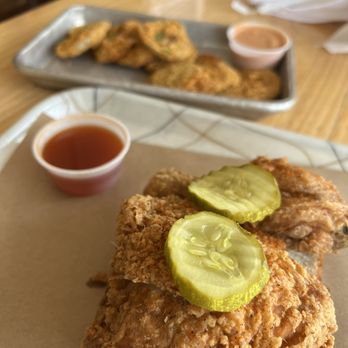 Grace Meat + Three - Dark meat quarter with fried green tomatoes. Hot honey as a side sauce for the chicken. - Southern Near Me - St Louis, Missouri Grace Meat + Three - Dark meat quarter with fried green tomatoes. Hot honey as a side sauce for the chicken. - Southern Near Me - St Louis, Missouri