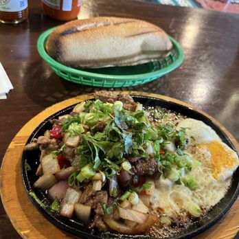 The Midway - Bo Ne! Sizzling skillet with beef and eggs served with bread. Yum! - Bars Near Me - West Sacramento, California
