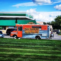 a taco truck parked in a parking lot