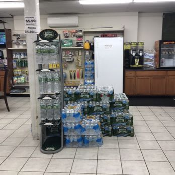 Quick Food - a display of bottled water in a grocery store - Convenience Stores Near Me - Winthrop, Massachusetts