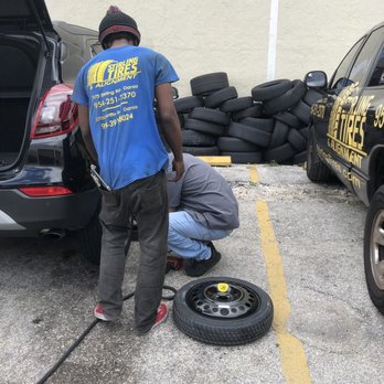 Stirling Tires - Manager and employee getting down and dirty replacing spare with fixed tire excellent work guys! - Tires Near Me - Hollywood, Florida