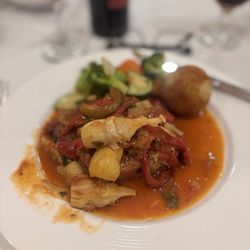 Bistro 107 - Grilled Pork Chops Entrée w hot peppers, artichoke and potato croquete - mainstay dish here - has some nice spice.