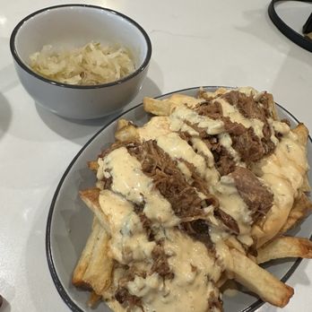 Prost Beer Hall - Haus Fries with sauerkraut on the side - Cocktail Bars Near Me - Elk Grove, California