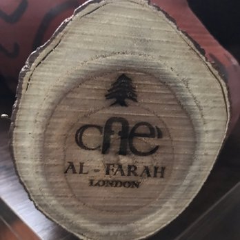 Al Farah Cafe - Cafe al farah symbol on wood - Lebanese Near Me - London, XGL