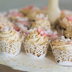 Pro Chic Events - Decadent butter cream icing, candied pearls and fondant fleurette's in ivory and blush, sweetly wrapped in pearlized covers.