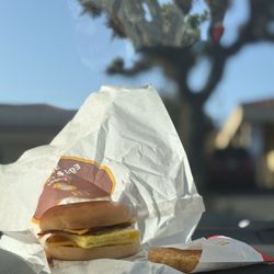 McDonald's - Bacon egg, and cheese on a bagel and a hash brown