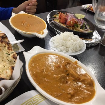 Sankranti - Butter Chicken up close and the Narangi Murg Tikka (tandoori grilled chicken) in the back. - Indian Near Me - Sunnyvale, California Sankranti - Butter Chicken up close and the Narangi Murg Tikka (tandoori grilled chicken) in the back. - Indian Near Me - Sunnyvale, California