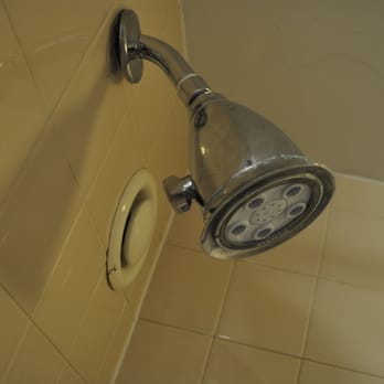 Indianapolis Marriott Downtown - Green gunk on shower head and rusty hole in the wall (vent?)  at the Marriott downtown Indianapolis - Hotels Near Me - Indianapolis, Indiana