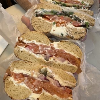 Black Sheep Bagel Cafe - Lox 2.0 on whole wheat everything bagel (top), and lox classic on garlic & onion bagel (bottom) - Bagels Near Me - Cambridge, Massachusetts