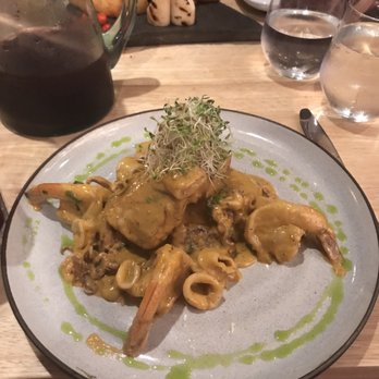 Llama Restaurant - Macho: Pan seared grouper fillet over Canary beans and rice pancake, topped with shrimp, calamari and adelicious secret cream of seafood. - Peruvian Near Me - Saint Augustine, Florida