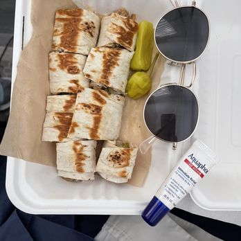Ammatoli - Chicken shawarma wrap that was $20 (Sunglasses and lip balm for scale) - Mediterranean Near Me - Long Beach, California