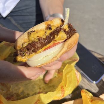 Midcity Smashed Burger - a hand holding a cheeseburger - Food Trucks Near Me - Bend, Oregon Midcity Smashed Burger - a hand holding a cheeseburger - Food Trucks Near Me - Bend, Oregon