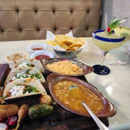 Street tacos (chorizo) plate comes with beans and rice Street tacos (chorizo) plate comes with beans and rice