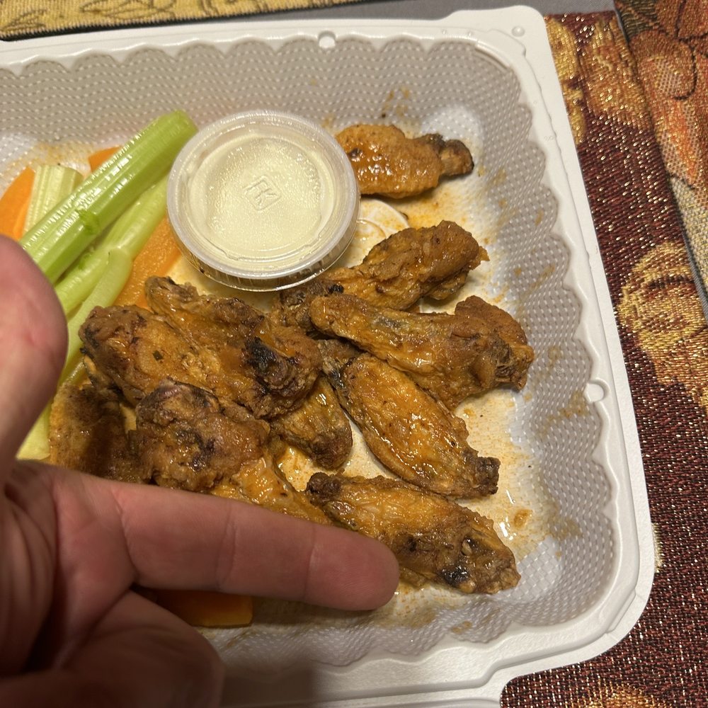 Angel's Cafe - a plate of chicken wings with celery and ranch dressing - Mexican Near Me - East Durham, New York Angel's Cafe - a plate of chicken wings with celery and ranch dressing - Mexican Near Me - East Durham, New York