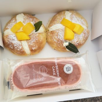 Paris Baguette - Two soft cake stacked on top of each other next to the Mango & Cream Brioche I think that's the name instead of separate boxes. - Bakeries Near Me - Pleasanton, California Paris Baguette - Two soft cake stacked on top of each other next to the Mango & Cream Brioche I think that's the name instead of separate boxes. - Bakeries Near Me - Pleasanton, California