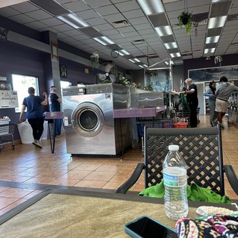 Clean Machine II - Me sitting a a lounge like table. Looking into the laundry area - Laundry Services Near Me - Bushnell, Florida