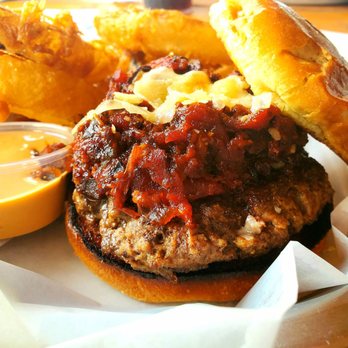 The Stone Inn - Bacon Jam burger with a side of Onion Rings - Bars Near Me - Chisago City, Minnesota