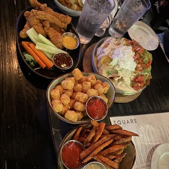 Tavern in the Square - Cornflake Fried Chicken Tenders**, Baked Crab and Sweet Corn Dip**, Sweet Potato Fries, Nachos**, Buffalo Cauliflower** - Sports Bars Near Me - Boston, Massachusetts Tavern in the Square - Cornflake Fried Chicken Tenders**, Baked Crab and Sweet Corn Dip**, Sweet Potato Fries, Nachos**, Buffalo Cauliflower** - Sports Bars Near Me - Boston, Massachusetts
