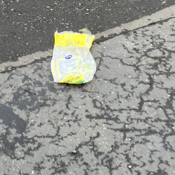 ReNew Water's Edge - Garbage overflowing from dumpster into parking lot (happens almost every single day!) - Apartments Near Me - Kent, Washington