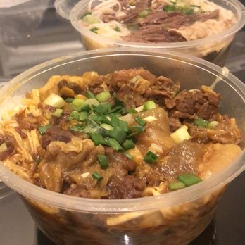 九記牛腩 - My curry beef tendon noodle with e noodle and in the back beef brisket noodles. This was take out! - Cantonese Near Me - Hong Kong, HK