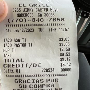 El Grill - a person holding a receipt in their hand - Mexican Near Me - Norcross, Georgia El Grill - a person holding a receipt in their hand - Mexican Near Me - Norcross, Georgia
