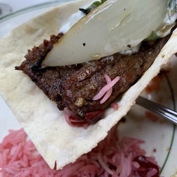 Raffi's Place - Filet mignonette in a lavash bread with a grilled onion, plate has the rice with cherries. - Middle Eastern Near Me - Glendale, California Raffi's Place - Filet mignonette in a lavash bread with a grilled onion, plate has the rice with cherries. - Middle Eastern Near Me - Glendale, California