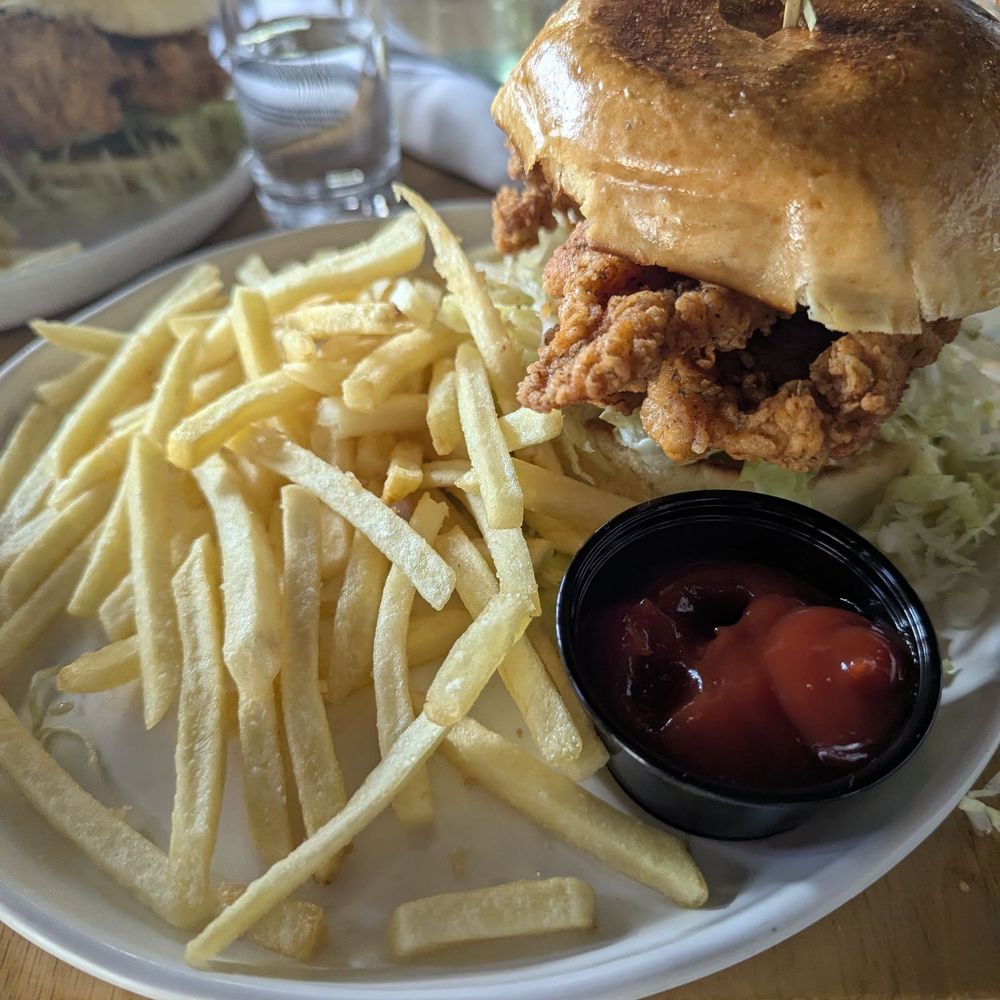 The Rutherford - Crispy chicken sandwich with french fries. - Cocktail Bars Near Me - New York, New York The Rutherford - Crispy chicken sandwich with french fries. - Cocktail Bars Near Me - New York, New York