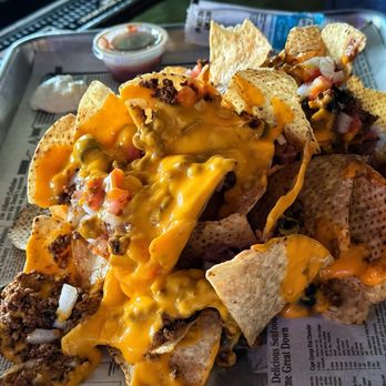 Mustangs Bar and Grill - "Can of Whoop Ass" nachos ($15.99) - Sports Bars Near Me - South Beloit, Illinois Mustangs Bar and Grill - "Can of Whoop Ass" nachos ($15.99) - Sports Bars Near Me - South Beloit, Illinois