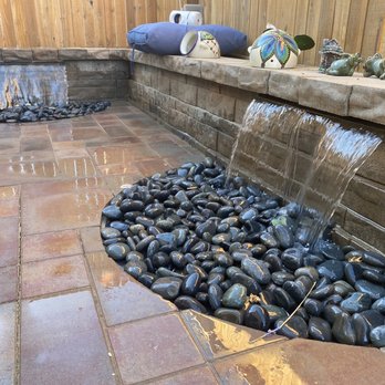 Forever Green Cali - Water fall with black spanish pebbles - Landscaping Near Me