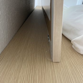 Hilton Garden Inn - Cocoa Beach - Just a few little dabs of glue holding a giant framed print in place on the headboard. - Hotels Near Me - Cocoa Beach, Florida