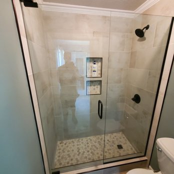 Clark Carpentry and Remodeling - a shower with a glass door - General Contractors Near Me Clark Carpentry and Remodeling - a shower with a glass door - General Contractors Near Me