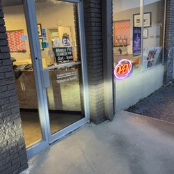 Gaddie Cleaners - Front door showing hours