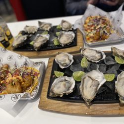 La Estrella Tacos & Seafood - Oysters look Fresh and Good! Now gotta start decorating oysters with onion/jalapeño mix!!