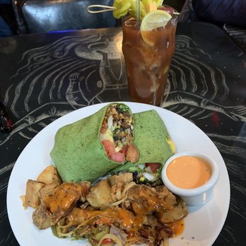 Stella's Lounge - Breakfast Burrito with black beans, scrambled tofu, rice, tomatoes and spinach. - Burgers Near Me - Grand Rapids, Michigan Stella's Lounge - Breakfast Burrito with black beans, scrambled tofu, rice, tomatoes and spinach. - Burgers Near Me - Grand Rapids, Michigan
