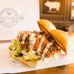 Bad Mutha Clucka - Bad Mutha Clucka - hormone free chicken tenders, miso ranch, shredded lettuce, and dill pickle slices.