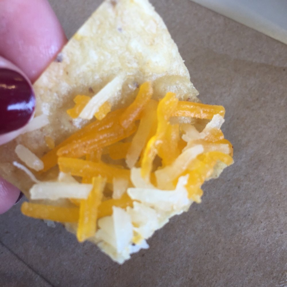Baja Fresh - Apparently this is a nacho. Unmelted from a bag cheese  on a chip. - Mexican Near Me - Vancouver, Washington
