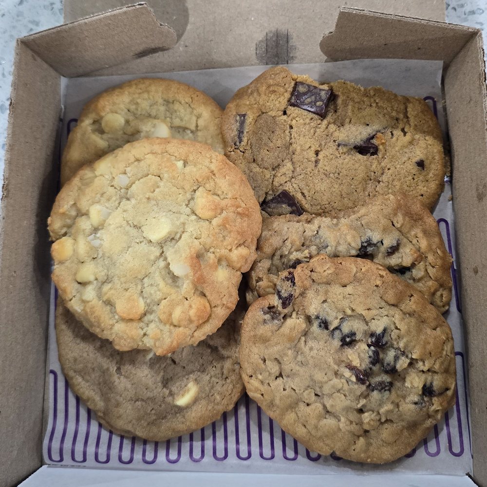 Insomnia Cookies - Chai Latte, White Chocolate Macadamia, Pumpkin Chocolate Chunk and Oatmeal Raisin~looks like the driver broke off a piece from the 2 cookies - Desserts Near Me - Hempstead, New York Insomnia Cookies - Chai Latte, White Chocolate Macadamia, Pumpkin Chocolate Chunk and Oatmeal Raisin~looks like the driver broke off a piece from the 2 cookies - Desserts Near Me - Hempstead, New York